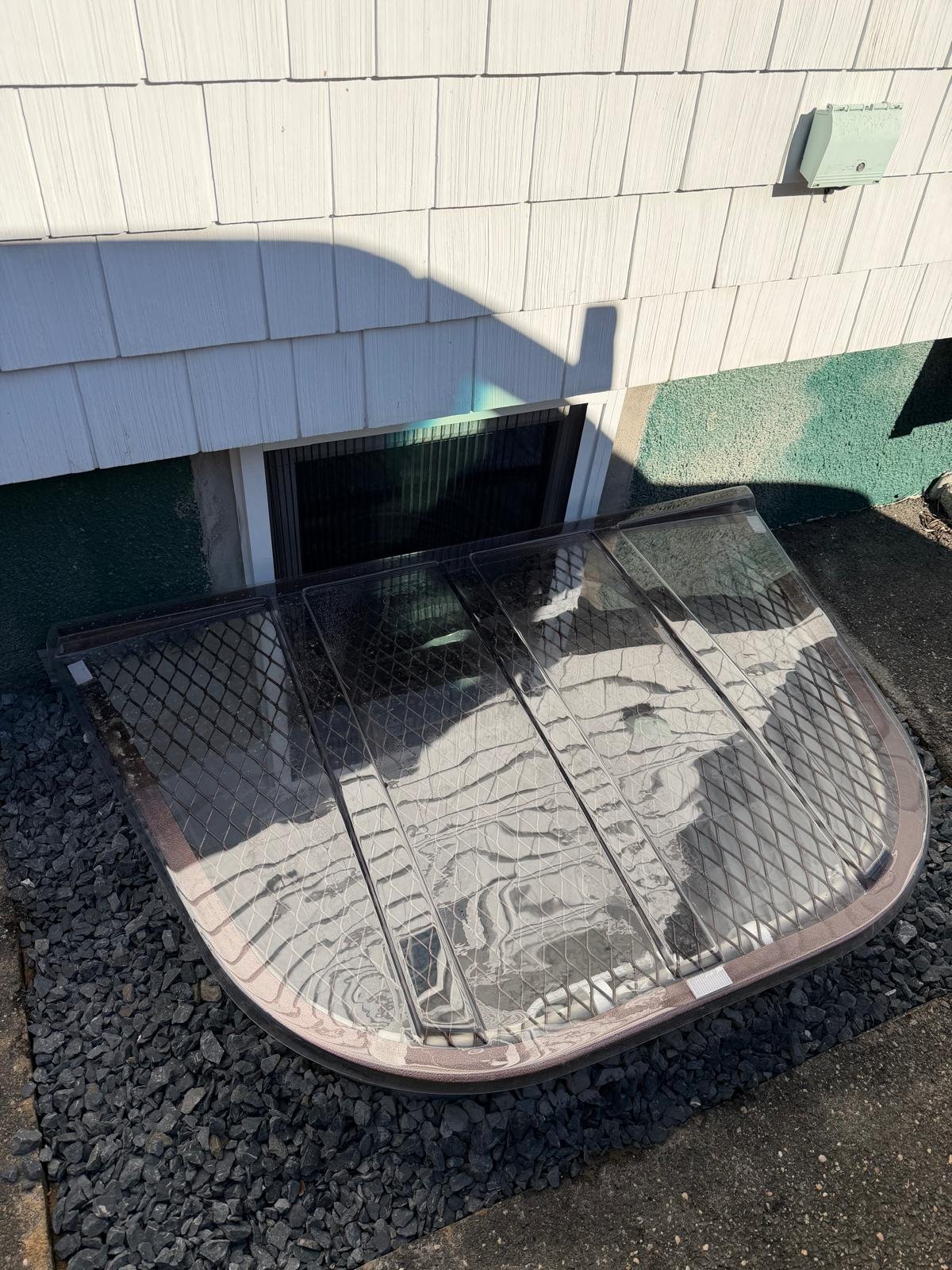 New basement window well and foundation opening