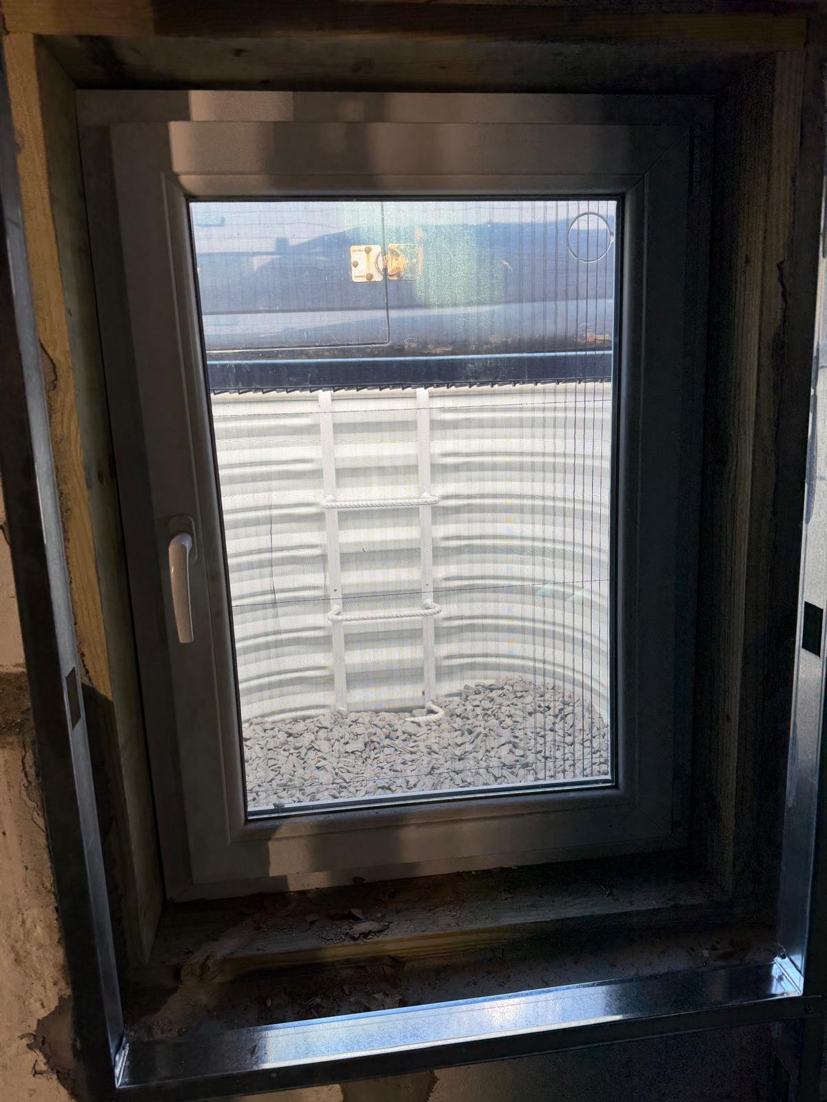 Completed enlarged basement egress window