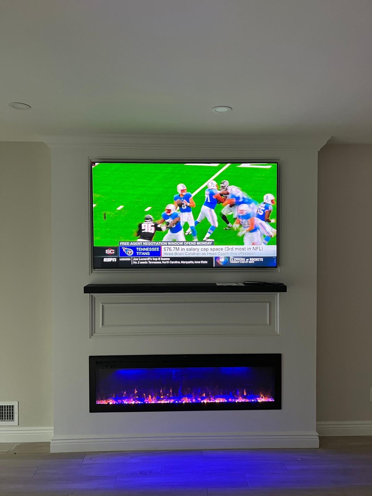 Built-in electric fireplace and custom TV wall